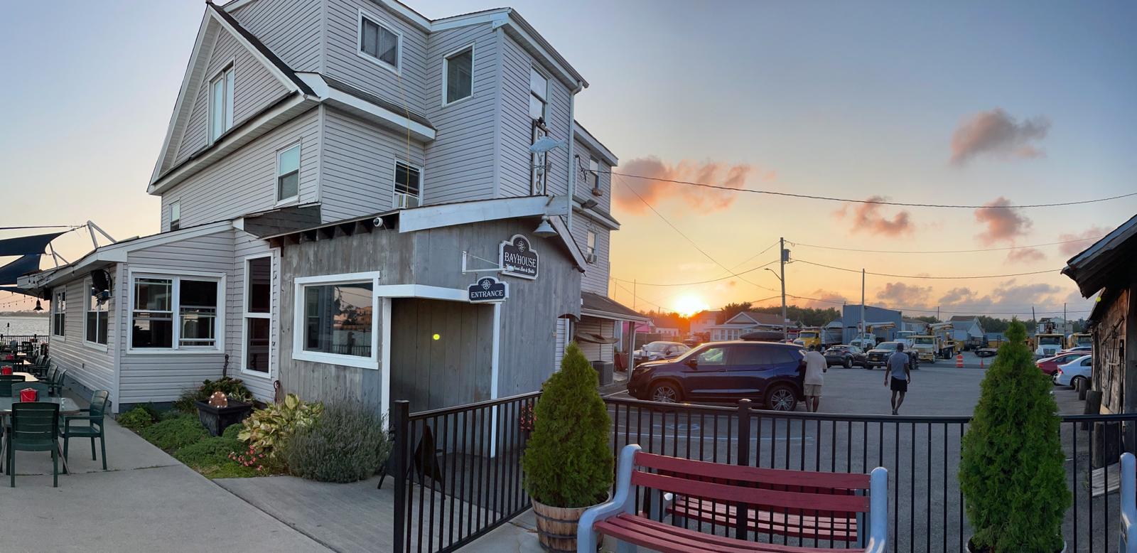 The Bayhouse building on Bayview Avenue at sunset, seen from the car park